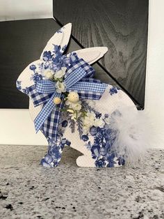 a blue and white bunny decoration sitting on top of a counter