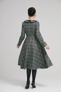 "Simple. With its pleated skirt and grayscale plaid pattern, this vintage wool dress epitomizes classic styling. She's all class and quality with no bells or whistles. Near-perfect vintage condition, designed with lapel collar, long sleeves and tie belt waist, it will be your favorite one of your wardrobe. Details: * 35% wool blend, 35% fiber and polyester, 30% nylon * Polyester lining * long sleeves * tie belt waist * lapel collar * button decoration in front * knee length * back zipper closure Classic Fall Vintage Dress For Workwear, Classic Vintage Dress For Fall Workwear, Classic Vintage Dress For Work In Fall, Vintage Plaid Dress For Winter, Vintage Plaid Winter Dress, Classic Vintage Fashion Dresses For Fall, Long Sleeve Plaid Dress For Winter, Winter Plaid Long Sleeve Dress, Retro Plaid Winter Dresses