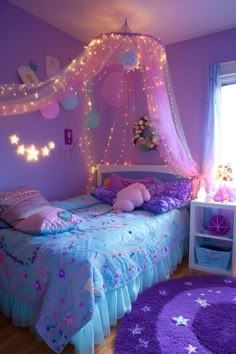 a bedroom decorated in purple and blue with fairy lights