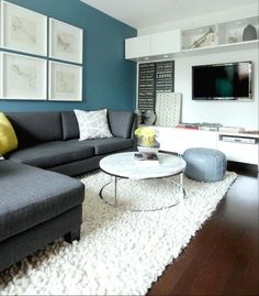 a living room filled with furniture and a flat screen tv