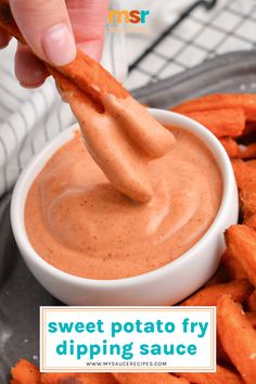 sweet potato fry dipping sauce in a white bowl with a hand dipping it into the dip