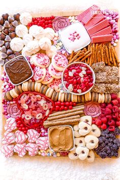 a platter filled with lots of different types of cookies and desserts on top of it