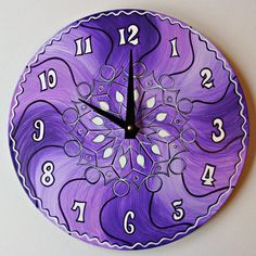 a purple and white clock with numbers on it