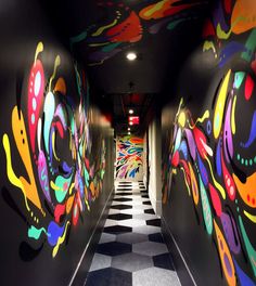 the hallway is decorated with brightly colored graffiti