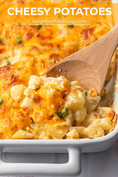 Wooden spoon scooping baked cheesy potatoes out of a white casserole dish. Cheesy Potatoes Casserole, Easy Cheesy Potatoes, Potatoes Casserole, Cheesy Potatoes Recipe, Yellow Squash Recipes, Cheesy Potato Casserole, Oven Roasted Turkey, Cheesy Potato, Homemade Gravy