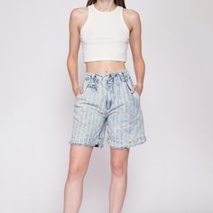 Vintage 80s acid wash striped jean shorts, with a high waist, pleating at the front, and cutoff legs. Measurements and Condition:    Fits like: Labeled size 7/8, fits modern women's extra small Fabric: Cotton denim Brand: Tarazzia Sport Condition: Very good, with light general wear, and some fraying at the button hole but it still works fine.   Waist: 25" Hips: 38" - taken at the bottom of the zipper opening Rise: 12" Inseam: 7" Shown on a 5'9" model with measurements of 33"-24"-37", usually wea Medium Wash Knee-length Jean Shorts For Spring, Vintage Jeans With Built-in Shorts For Spring, Acid Wash Cotton Cutoff Jeans, Acid Wash High Rise Cotton Bottoms, Acid Wash High Rise Relaxed Fit Bottoms, Acid Wash High-rise Cotton Bottoms, Retro Cutoff Shorts For Spring, High Rise Acid Wash Relaxed Fit Bottoms, Distressed High-waisted Jean Shorts For Spring