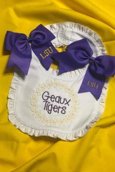 LSU game day outfit for your baby!  Follow us for more embroidered baby gifts and custom baby bibs. Lsu Game Day Outfit, Embroidered Baby Gifts, Monogrammed Baby Clothes, Lsu Babies, Tiger Baby, Lsu Fans, Personalized Bibs, Personalized Baby Bibs, Geaux Tigers