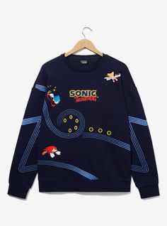 You've gotta go fast when you're wearing this Sonic the Hedgehog sweatshirt! Featuring portraits of Sonic  Tails  and Knuckles with racing lines tracing Sonic's path and gold rings  this crewneck is perfect for fans of the video game series.A BoxLunch Exclusive!52% cotton; 48% polyesterListed in unisex sizesWash cold with like colors; dry lowImported Sonic Outfits Ideas, Sonic The Hedgehog Clothes, Sonic Blanket, Sonic Clothes, Sonic Y2k, Sonic Merch, Sonic Tails And Knuckles, Tails And Knuckles, Sonic T Shirt