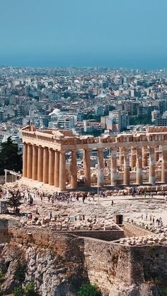 an aerial view of the ancient city of acrobatia, with ruins and columns