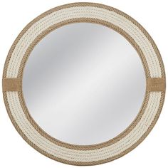 a round mirror with rope around it