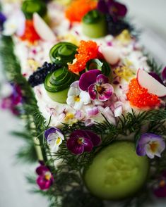 a close up of a cake with flowers on it