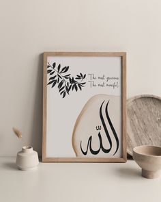 an arabic calligraphy is displayed next to a bowl