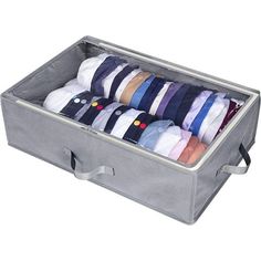 an open suitcase filled with lots of different colored shirts on top of each other's ties