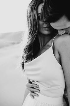 black and white photograph of a couple embracing each other