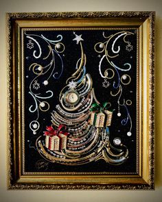 a christmas tree made out of books with presents on it in a gold framed frame