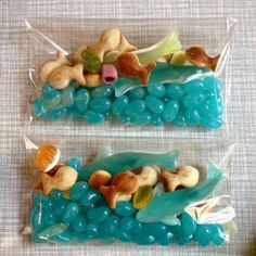 two bags filled with blue and green candies