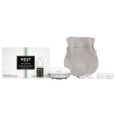 the nest travel kit includes three items including a bag, two bottles and one container