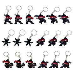 a bunch of different key chains that are shaped to look like cartoon characters with black and red colors