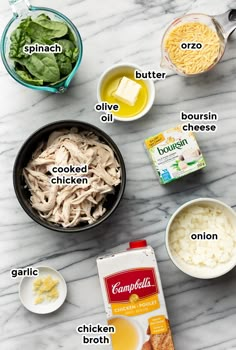 ingredients for chicken broth laid out on a marble counter top