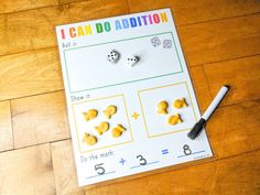 i can do addition game with dices and numbers on the table next to it