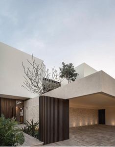 the house is made out of concrete and has an open courtyard