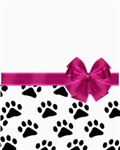 a pink bow on top of a black and white background with paw prints