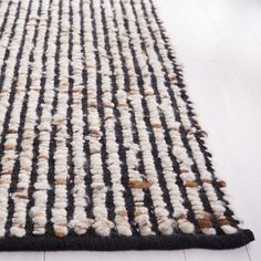 a black and white rug on the floor