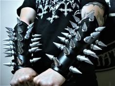 MDLG0221  FROM HELL, ANOTHER METAL DEVASTATION CREATION, A HIGH-QUALITY GIANT SCREWBACK SPIKED GAUNTLET! 7 ROWS OF 2" GIANT ALUMINUM SPIKES. A TOTAL OF 26 SPIKES IN ALL. GAUNTLET IS MADE OF 1 1/8" GENUINE LEATHER. ADJUSTABLE TO YOUR ARM. WITH 4 STRAPS... 4 BUCKLES. THE QUALITY OF THIS GAUNTLET WILL LAST A LIFETIME. NOTE: This Listing Is For One Gauntlet Only. If You Want A Pair. Buy 2 (we will send you left & right) If you bought this GAUNTLET let us know with a message what side you prefer LEFT or RIGHT another way we will send you a left side  UNISEX:  LENGHT 8 1/2" INCHES LONG (writs to elbow) Wrist- from 6 1/2" to 9 1/2" Forearm from 10" to 13"   STANDARD:  LENGHT 11" INCHES LONG (writs to elbow) Wrist-from 7" to 10" Forearm from 10" to 14" Leather Gauntlet, Studs And Spikes, Thrash Metal, Leather Items, Black Metal, Aesthetic Clothes, Genuine Leather, Cute Outfits, Outfit Accessories