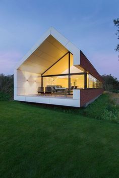 a modern house with an open roof and large windows