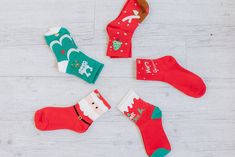 Step up your sock game this holiday season with these 5Pcs Christmas Cartoon Print Socks. These festive and quirky socks will add a touch of playfulness to any outfit. With their fun prints, they are sure to make you stand out from the crowd. Perfect for spreading holiday cheer! Model Info: Models are 5'7", Size 2, wearing smalls Material: 100% Polyester Fun Christmas Gift Socks, Novelty Christmas Gift Socks, Novelty Winter Socks For Gift, Novelty Winter Socks For Gifts, Novelty Socks For Winter Gift, Novelty Winter Socks As Gift, Novelty Red Socks For Winter, Red Novelty Socks For Winter, Fun Red Socks For Gifts