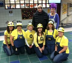 a group of people in costumes posing for a photo