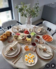 the table is set with plates and bowls