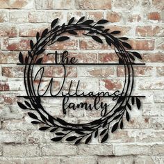 the village family sign on a brick wall