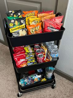 a cart filled with snacks and drinks on the floor