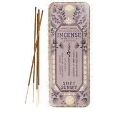 an incense stick with two sticks next to it