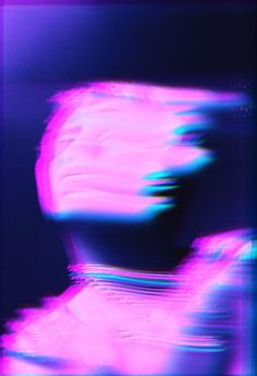 a blurry image of a woman's head with pink and blue colors on it