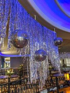 disco ball chandeliers hanging from the ceiling