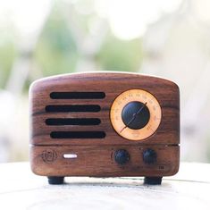 a wooden radio sitting on top of a table