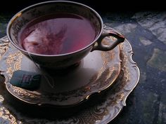 a cup of tea sitting on top of a saucer