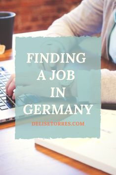 a person typing on a laptop with the words finding a job in germany