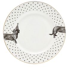 a black and white plate with two dachshund dogs on it's side