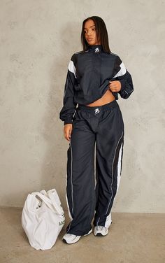 Bring all the cool vibes to your wardrobe this season with this PrettyLittleThing navy oversized panelled detail track top. Its navy hue material is super easy to style and its oversized fit is sure to gain you all the compliments. This track top also features panel detail which adds that extra edge to your look. Team with the matching track pants, chunky trainers and everyday accessories for a look that won't go unnoticed. Length approx 48cm/19inch (Based on a sample size UK 8) Model wears size UK 8/ EU 36/ AUS 8/ US 4Model Height - 5ft 7inchp]:!mb-0inch>Brand: PrettyLittleThingCategory: SweatProduct type: SweatshirtColour: NavyMaterial: ShellDesign: PrintNeckline: High NeckSleeves: LongOccasion: Day 90s Tracksuit Outfit, Track Suits Women Style, Tracksuit Outfit Women, Tims Boots, 90s Tracksuit, Track Suits Women, Track Pants Outfit, Tracksuit Outfit, Fool Proof