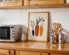 a kitchen counter with a microwave, toaster oven and utensils on it