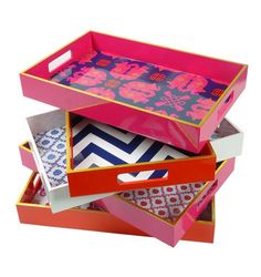 three colorful boxes stacked on top of each other with different patterns and designs in them