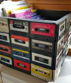 a stack of cassettes sitting on top of a table