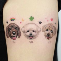 three dogs are shown on the side of a woman's thigh with their name written in different languages