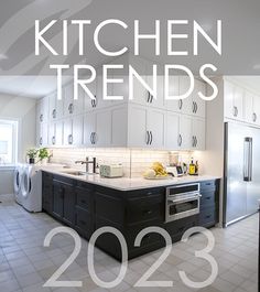 a kitchen with white cabinets and tile flooring