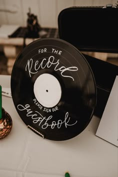 a record sitting on top of a white table