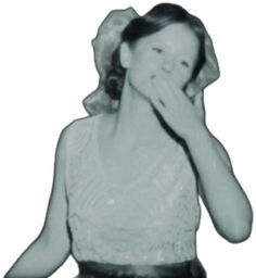 a black and white photo of a woman covering her face