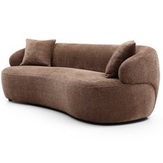 a brown couch sitting on top of a white floor